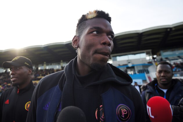 Manchester United and France midfielder Paul Pogba speaks prior to a gala football match between All Star France and Guinea at the Vallee du Cher Stadium in Tours, central France, on December 29, 2019, as part of the