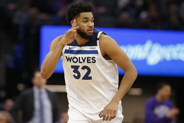 Minnesota Timberwolves center Karl-Anthony Towns flashes three fingers after scoring a 3-pointer during the second half of an NBA basketball game against the Sacramento Kings in Sacramento, Calif., Monday, Feb. 3, 2020. The Kings won 113-109. (AP Photo/Rich Pedroncelli)