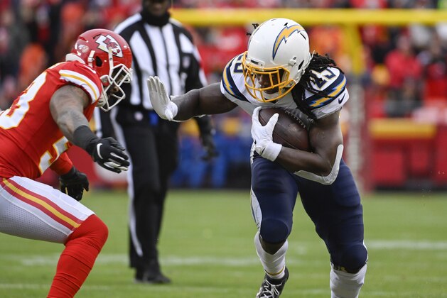 Los Angeles Chargers running back Melvin Gordon (25) runs against the Kansas City Chiefs during the second half of an NFL football game in Kansas City, Mo., Sunday, Dec. 29, 2019. (AP Photo/Reed Hoffmann)