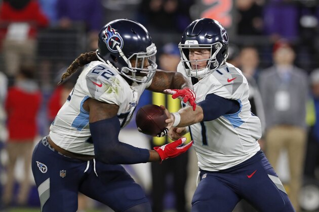 BALTIMORE, MD - JANUARY 11: Ryan Tannehill #17 of the Tennessee Titans hands the ball off to Derrick Henry #22 of the Tennessee Titans during the third quarter of the AFC Divisional Playoff game against the Baltimore Ravens at M&T Bank Stadium on January 11, 2020 in Baltimore, Maryland. (Photo by Todd Olszewski/Getty Images)