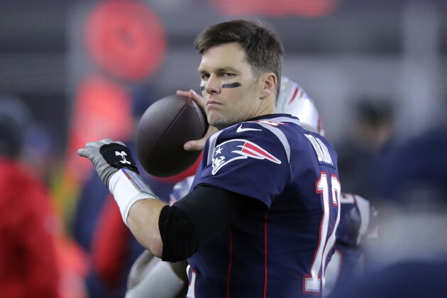 New England Patriots quarterback Tom Brady tosses the football on the sideline in the first half of an NFL wild-card playoff football game against the Tennessee Titans, Saturday, Jan. 4, 2020, in Foxborough, Mass. (AP Photo/Charles Krupa)