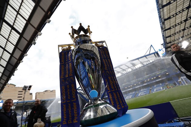The Premier League trophy stands on display ahead of the English Premier League football match between Chelsea and Liverpool at Stamford Bridge in London on September 16, 2016. / AFP / Adrian DENNIS / RESTRICTED TO EDITORIAL USE. No use with unauthorized audio, video, data, fixture lists, club/league logos or 'live' services. Online in-match use limited to 75 images, no video emulation. No use in betting, games or single club/league/player publications.  /         (Photo credit should read ADRIAN DENNIS/AFP via Getty Images)