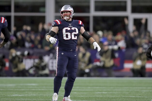 New England Patriots guard Joe Thuney waits to congratulate quarterback Tom Brady on his touchdown pass in the second half of an NFL football game against the New York Giants, Thursday, Oct. 10, 2019, in Foxborough, Mass. (AP Photo/Charles Krupa)