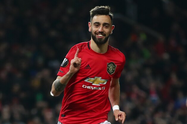 MANCHESTER, ENGLAND - FEBRUARY 27: Bruno Fernandes of Manchester United celebrates after scoring his team's first goal from the penalty spot during the UEFA Europa League round of 32 second leg match between Manchester United and Club Brugge at Old Trafford on February 27, 2020 in Manchester, United Kingdom. (Photo by Clive Brunskill/Getty Images)