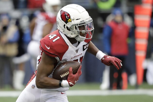 Arizona Cardinals running back Kenyan Drake on his way to an 80-yard touchdown run during the first half of an NFL football game against the Seattle Seahawks, Sunday, Dec. 22, 2019, in Seattle. (AP Photo/Elaine Thompson)