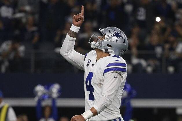 Dallas Cowboys quarterback Dak Prescott (4) celebrates after making a touchdown throw against the Washington Redskins during the second half of an NFL football game in Arlington, Texas, Sunday, Dec. 15, 2019. Prescott connected with wide receiver Michael Gallup for the touchdown. (AP Photo/Ron Jenkins)