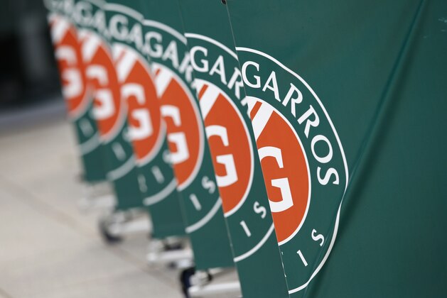 A crowd control barrier bear the logo of the French Open tennis tournament at the Roland Garros stadium in Paris, France, Saturday, June 2, 2018. (AP Photo/Christophe Ena )