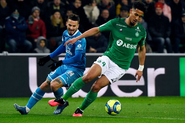 Marseille's Argentinian forward Dario Benedetto (L) vies for the ball with Saint-Etienne's French defender William Saliba (R) during the French L1 football match between Saint-Etienne (ASSE) and Marseille (OM) on February 5, 2020, at the Geoffroy Guichard Stadium in Saint-Etienne, central France. (Photo by JEAN-PHILIPPE KSIAZEK / AFP) (Photo by JEAN-PHILIPPE KSIAZEK/AFP via Getty Images) Marseille's Argentinian forward Dario Benedetto (L) vies for the ball with Saint-Etienne's French defender William Saliba (R) during the French L1 football match between Saint-Etienne (ASSE) and Marseille (OM) on February 5, 2020, at the Geoffroy Guichard Stadium in Saint-Etienne, central France. (Photo by JEAN-PHILIPPE KSIAZEK / AFP) (Photo by JEAN-PHILIPPE KSIAZEK/AFP via Getty Images)