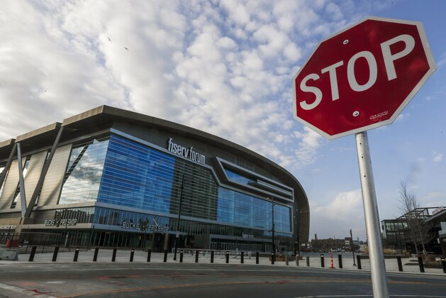 Fiserv Forum stands Thursday March 12, 2020, in Milwaukee. The NBA has suspended its season. The Milwaukee Bucks had been scheduled to play the Boston Celtics on Thursday night at the arena. (AP Photo/Morry Gash)