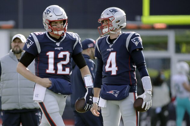 New England Patriots quarterbacks Tom Brady, left, and Jarrett Stidham warm up before an NFL football game against the Miami Dolphins, Sunday, Dec. 29, 2019, in Foxborough, Mass. (AP Photo/Elise Amendola)