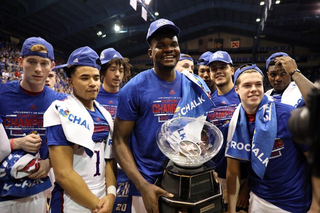 LAWRENCE, KANSAS - MARCH 04:  Udoka Azubuike #35 of the Kansas Jayhawks holds the Big 12 Championship Trophy alongside teammates after defeating the TCU Horned Frogs to win the game at Allen Fieldhouse on March 04, 2020 in Lawrence, Kansas. (Photo by Jamie Squire/Getty Images)
