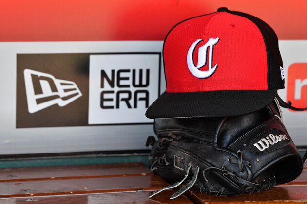 CINCINNATI, OH - MAY 14:  A close up view of a hat and baseball glove in the dugout with the New Era logo before a game between the Cincinnati Reds and the Chicago Cubs at Great American Ball Park on May 14, 2019 in Cincinnati, Ohio. Chicago defeated Cincinnati 3-1. (Photo by Jamie Sabau/Getty Images) *** Local Caption ***