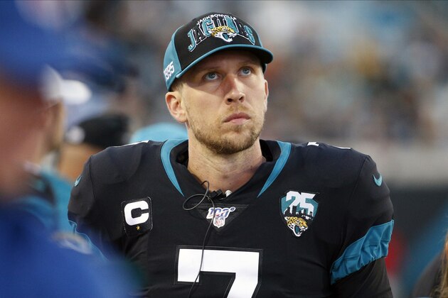 FILE - In this Dec. 8, 2019, file photo, Jacksonville Jaguars quarterback Nick Foles walks along the bench area as he looks up at the scoreboard during the first half of an NFL football game against the Los Angeles Chargers, in Jacksonville, Fla. A person familiar with the trade says the Jacksonville Jaguars have agreed to send quarterback Nick Foles to the Chicago Bears for a compensatory fourth-round draft pick. The person spoke to The Associated Press on condition of anonymity because trades don't become official until the league year begins later Wednesday, March 18, 2020. (AP Photo/Stephen B. Morton, File)