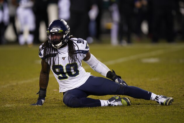 Seattle Seahawks' Jadeveon Clowney lies on the field during the second half of an NFL wild-card playoff football game against the Philadelphia Eagles, Sunday, Jan. 5, 2020, in Philadelphia. (AP Photo/Chris Szagola)