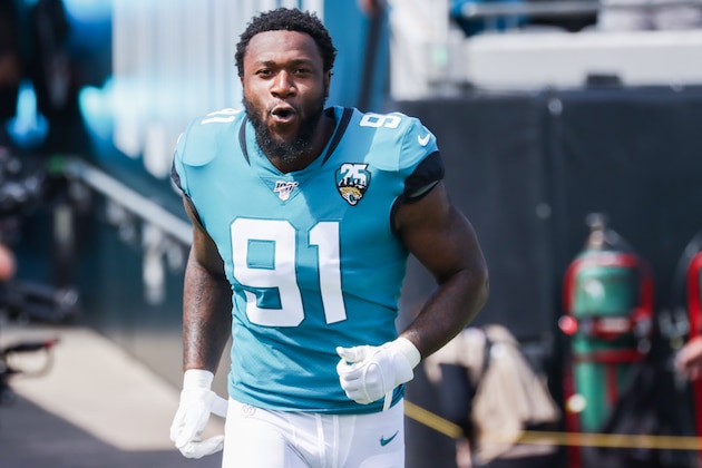 JACKSONVILLE, FLORIDA - OCTOBER 13: Yannick Ngakoue #91 of the Jacksonville Jaguars charges onto the field to face the New Orleans Saints before the start of the first quarter at TIAA Bank Field on October 13, 2019 in Jacksonville, Florida. (Photo by Harry Aaron/Getty Images)