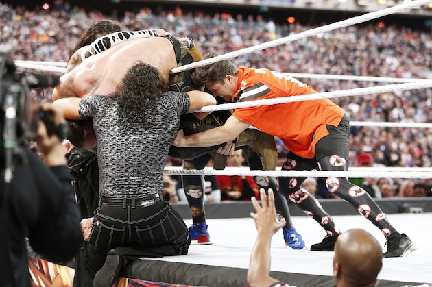 EAST RUTHERFORD, NEW JERSEY - APRIL 07: Braun Strowman battles SNL's Michael Che and Colin Jost at WWE WrestleMania at Met Life Stadium on April 07, 2019 in East Rutherford, New Jersey. (Photo by Brian Ach/Getty Images for WWE)