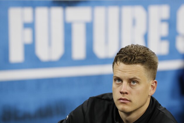 LSU quarterback Joe Burrow watches a drill at the NFL football scouting combine in Indianapolis, Thursday, Feb. 27, 2020. (AP Photo/Charlie Neibergall)