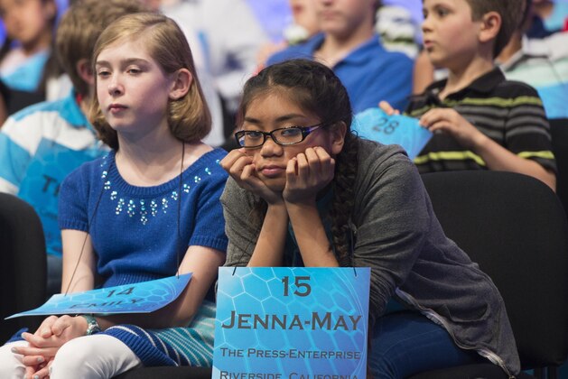 Jenna-May Ingal of Cathedral City, California, waits onstage following her turn during the 3rd round of the 88th Annual Scripps National Spelling Bee at National Harbor in Oxon Hill, Maryland, May 27, 2015. AFP PHOTO / SAUL LOEB        (Photo credit should read SAUL LOEB/AFP via Getty Images)