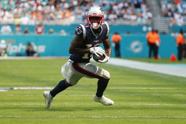 New England Patriots wide receiver Phillip Dorsett (13) runs the ball, during the second half at an NFL football game against the Miami Dolphins, Sunday, Sept. 15, 2019, in Miami Gardens, Fla. (AP Photo/Wilfredo Lee)