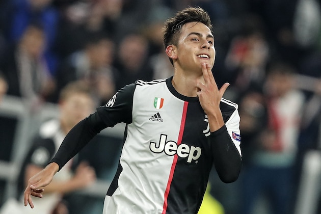 Juventus' Paulo Dybala celebrates after scoring the opening goal during the Champions League group D soccer match between Juventus and Atletico Madrid at the Allianz stadium in Turin, Italy, Tuesday, Nov. 26, 2019. (AP Photo/Antonio Calanni)