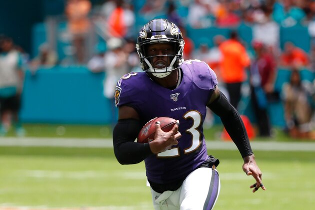 Baltimore Ravens strong safety Tony Jefferson (23) runs the ball during the first half at an NFL football game against the Miami Dolphins, Sunday, Sept. 8, 2019, in Miami Gardens, Fla. (AP Photo/Brynn Anderson)