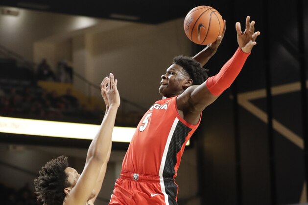 Georgia guard Anthony Edwards (5) drives against Vanderbilt's Braelee Albert, left, in the first half of an NCAA college basketball game Saturday, Feb. 22, 2020, in Nashville, Tenn. (AP Photo/Mark Humphrey)