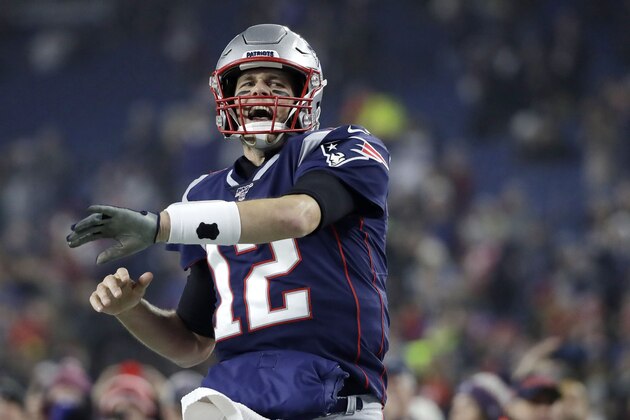 New England Patriots quarterback Tom Brady charges onto the field to warm up before an NFL wild-card playoff football game against the Tennessee Titans, Saturday, Jan. 4, 2020, in Foxborough, Mass. (AP Photo/Elise Amendola)