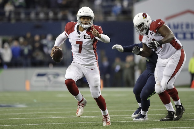Arizona Cardinals quarterback Brett Hundley (7) keeps the ball during the second half of an NFL football game against the Seattle Seahawks, Sunday, Dec. 22, 2019, in Seattle. (AP Photo/Elaine Thompson)