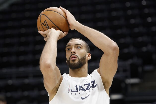 Utah Jazz's Rudy Gobert shoots the ball in a pregame warmup before an NBA basketball game against the Houston Rockets on Saturday, Feb. 22, 2020, in Salt Lake City. (AP Photo/Kim Raff)