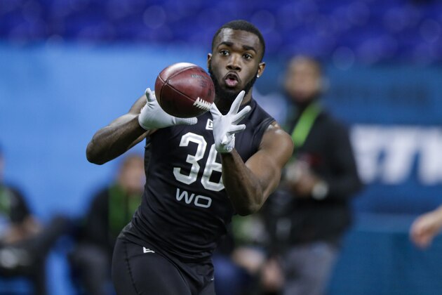 Baylor wide receiver Denzel Mims runs a drill at the NFL football scouting combine in Indianapolis, Thursday, Feb. 27, 2020. (AP Photo/Michael Conroy)