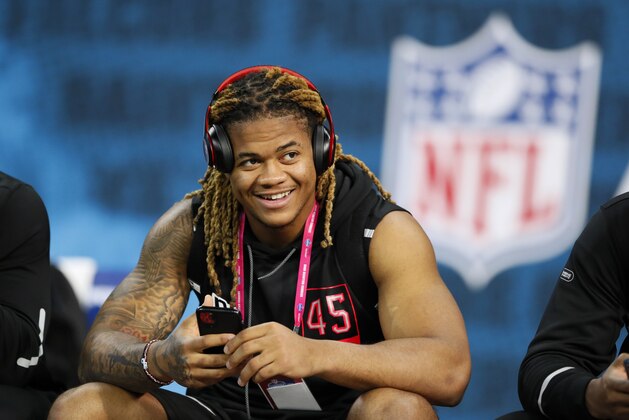 Ohio State defensive lineman Chase Young watches a drill at the NFL football scouting combine in Indianapolis, Saturday, Feb. 29, 2020. (AP Photo/Charlie Neibergall)
