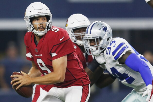 Dallas Cowboys defensive end Randy Gregory (94) pressures Arizona Cardinals quarterback Sam Bradford (9) during the first half of a preseason NFL football game in Arlington, Texas, Sunday, Aug. 26, 2018. (AP Photo/Roger Steinman)