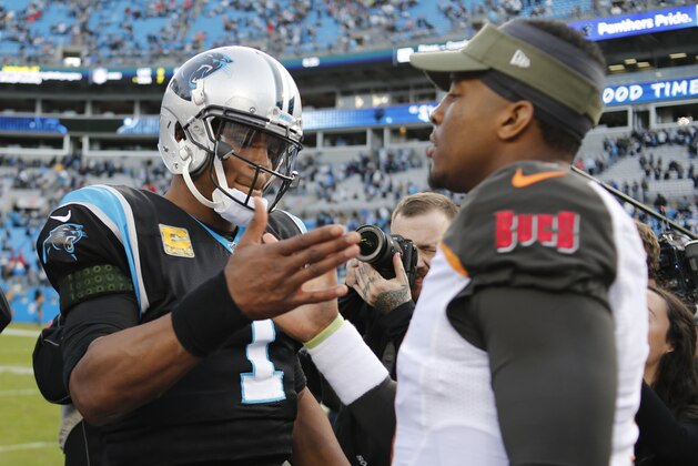 Carolina Panthers' Cam Newton (1) greets Tampa Bay Buccaneers' Jameis Winston (3) after an NFL football game in Charlotte, N.C., Sunday, Nov. 4, 2018. (AP Photo/Nell Redmond)