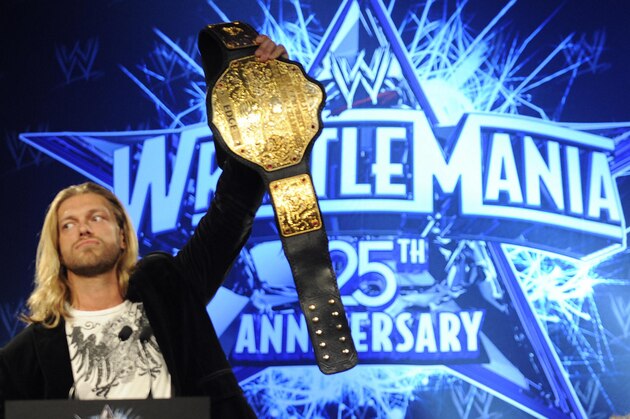 WWE (World Wrestling Entertainment) World Heavyweight Champion Edge and Chris Jericho (R)  during a press conference in New York March 31, 2009 to promote the 25th Anniversary of WrestleMania to take place at Reliant Stadium in Houston, Texas on April 5th.  AFP PHOTO/ TIMOTHY A. CLARY (Photo credit should read TIMOTHY A. CLARY/AFP via Getty Images)