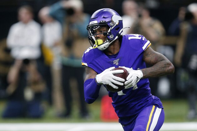Minnesota Vikings wide receiver Stefon Diggs (14) carries in the second half of an NFL wild-card playoff football game against the New Orleans Saints, Sunday, Jan. 5, 2020, in New Orleans. (AP Photo/Butch Dill)