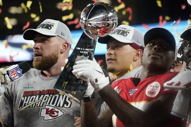 (L-R) Chiefs Tight End Travis Kelce, Quarterback Patrick Mahomes and Wide receiver Mecole Hardman hold the trophy after winning Super Bowl LIV between the Kansas City Chiefs and the San Francisco 49ers at Hard Rock Stadium in Miami Gardens, Florida, on February 2, 2020. (Photo by TIMOTHY A. CLARY / AFP) (Photo by TIMOTHY A. CLARY/AFP via Getty Images) (L-R) Chiefs Tight End Travis Kelce, Quarterback Patrick Mahomes and Wide receiver Mecole Hardman hold the trophy after winning Super Bowl LIV between the Kansas City Chiefs and the San Francisco 49ers at Hard Rock Stadium in Miami Gardens, Florida, on February 2, 2020. (Photo by TIMOTHY A. CLARY / AFP) (Photo by TIMOTHY A. CLARY/AFP via Getty Images)