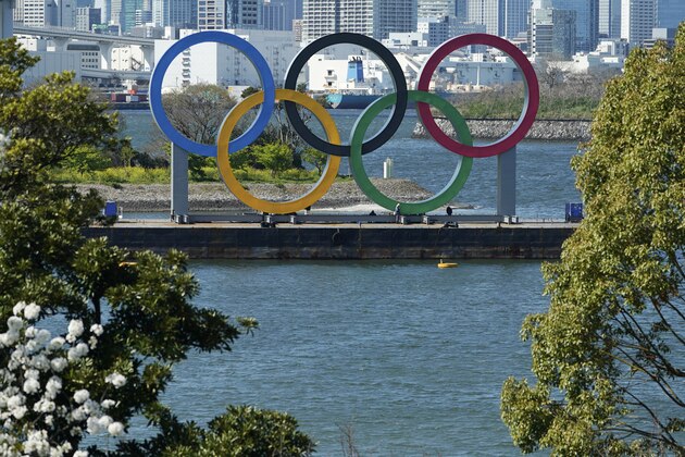 The Olympic rings is seen at Tokyo's Odaiba district Tuesday, March 24, 2020. The Tokyo Olympics are probably going to happen, but almost surely in 2021 rather than in four months as planned. (AP Photo/Eugene Hoshiko)