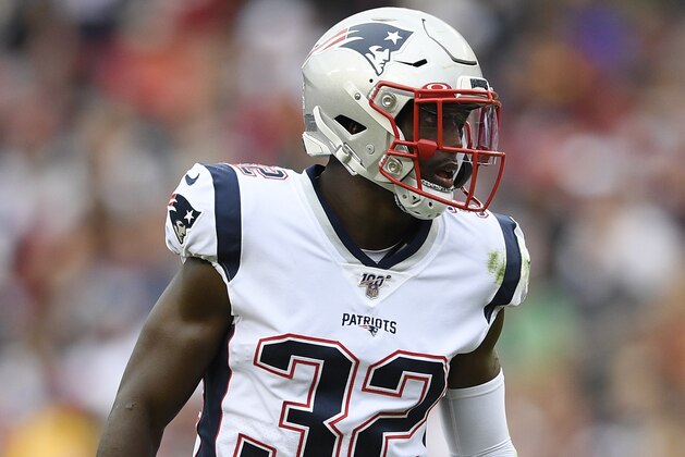 New England Patriots free safety Devin McCourty (32) stands on the field during the second half of an NFL football game against the Washington Redskins, Sunday, Oct. 6, 2019, in Washington. (AP Photo/Nick Wass)