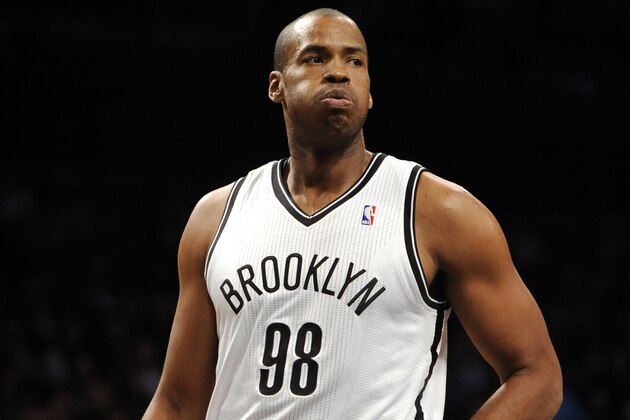 Brooklyn Nets center Jason Collins (98) reacts to a foul call during an NBA basketball game against the Toronto Raptors on Monday, March 10, 2014 at Barclays Center in New York. (AP Photo/Kathy Kmonicek)