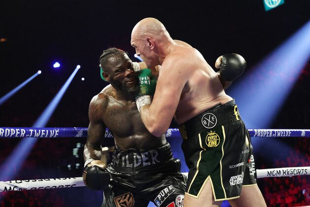 LAS VEGAS, NEVADA - FEBRUARY 22:  Tyson Fury (L) punches Deontay Wilder during their Heavyweight bout for Wilder's WBC and Fury's lineal heavyweight title on February 22, 2020 at MGM Grand Garden Arena in Las Vegas, Nevada.  (Photo by Al Bello/Getty Images)