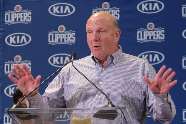 From left, Los Angeles Clippers team chairman Steve Ballmer introduces Paul George and Kawhi Leonard at a press conference at the Green Meadows Recreation Center in Los Angeles, Wednesday, July 23, 2019. (AP Photo/Ringo H.W. Chiu)