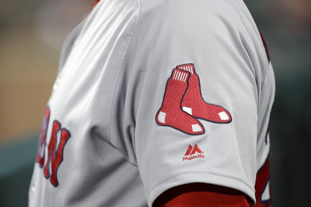 The Boston Red Sox logo is seen on first base coach Ruben Amaro Jr's jersey during a baseball game against the Baltimore Orioles in Baltimore, Saturday, April 22, 2017. (AP Photo/Patrick Semansky)