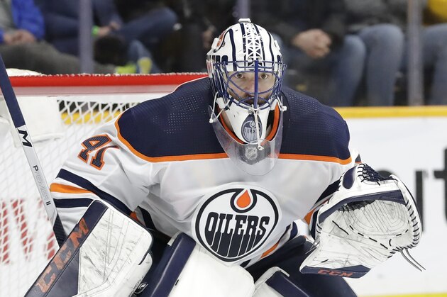 Edmonton Oilers goaltender Mike Smith plays against the Nashville Predators in an NHL hockey game Monday, March 2, 2020, in Nashville, Tenn. (AP Photo/Mark Humphrey)