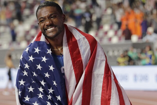 Justin Gatlin, of the United States, celebrates winning the silver medal in the men's 100m final at the World Athletics Championships in Doha, Qatar, Saturday, Sept. 28, 2019. (AP Photo/Nariman El-Mofty)