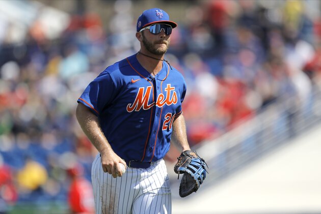 New York Mets first baseman Pete Alonso heads to the dugout during the first inning of a spring training baseball game against the St. Louis Cardinals, Wednesday, March 4, 2020, in Port St. Lucie, Fla. (AP Photo/Julio Cortez)
