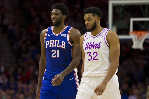 PHILADELPHIA, PA - JANUARY 15: Joel Embiid #21 of the Philadelphia 76ers and Karl-Anthony Towns #32 of the Minnesota Timberwolves look on at the Wells Fargo Center on January 15, 2019 in Philadelphia, Pennsylvania. NOTE TO USER: User expressly acknowledges and agrees that, by downloading and or using this photograph, User is consenting to the terms and conditions of the Getty Images License Agreement. (Photo by Mitchell Leff/Getty Images)