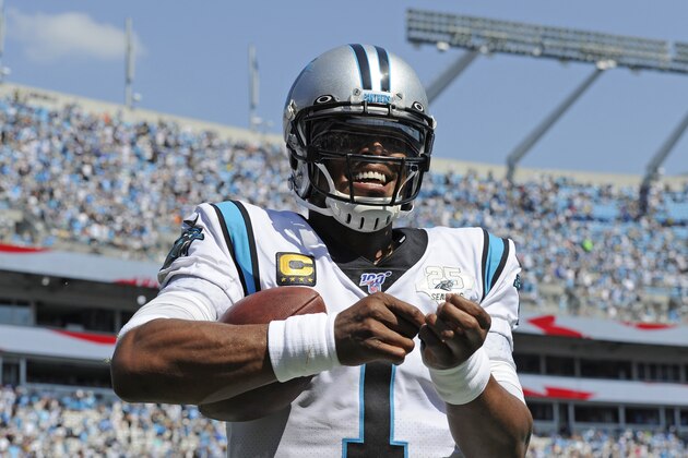 Carolina Panthers quarterback Cam Newton (1) reacts following running back Christian McCaffrey's touchdown against the Los Angeles Rams during the second half of an NFL football game in Charlotte, N.C., Sunday, Sept. 8, 2019. (AP Photo/Mike McCarn)