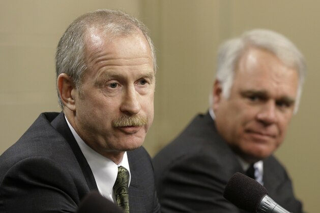 Dallas Stars newly-hired general manager Jim Nill, left, responds to a reporter's question during a news conference as president and CEO Jim Lites, right, watches Monday, April 29, 2013, in Dallas. AP Photo/Tony Gutierrez)