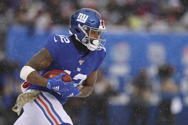 New York Giants wide receiver Cody Latimer (12) runs the ball up the field during the first half of an NFL football game against the Green Bay Packers, Sunday, Dec. 1, 2019, in East Rutherford, N.J. The Green Bay Packers won 31-13. (AP Photo/Steve Luciano)