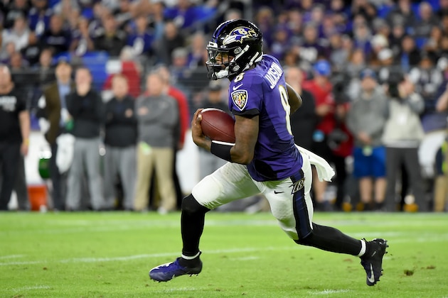 BALTIMORE, MARYLAND - JANUARY 11: Lamar Jackson #8 of the Baltimore Ravens runs against the Tennessee Titans during the AFC Divisional Playoff game at M&T Bank Stadium on January 11, 2020 in Baltimore, Maryland. (Photo by Will Newton/Getty Images)